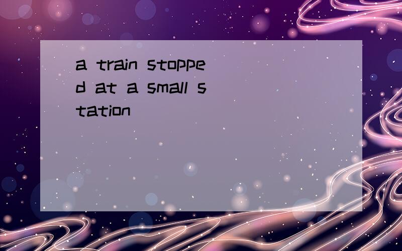 a train stopped at a small station